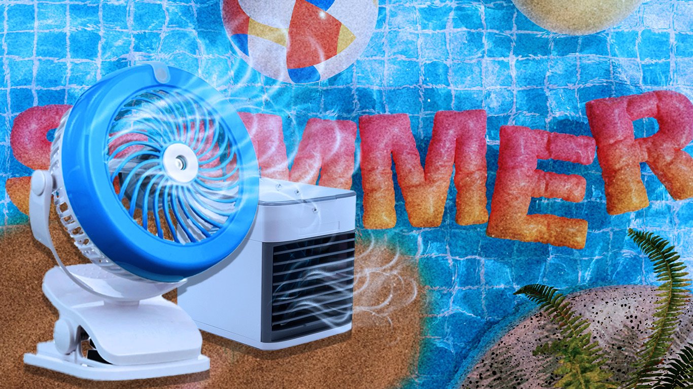 A portable blue and white clip-on fan blows air, with a small white personal air cooler next to it. In the background, large orange and red letters spell "SUMMER" partially submerged in a swimming pool. Beach balls are floating in the pool, and a sandy beach with a fern is visible in the foreground.