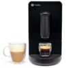 A black GE Profile automatic espresso machine next to two glass mugs, one with a latte and the other with a fresh espresso shot.